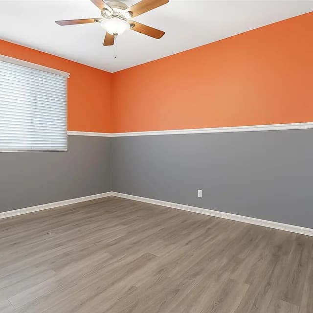 Painter painting a wall